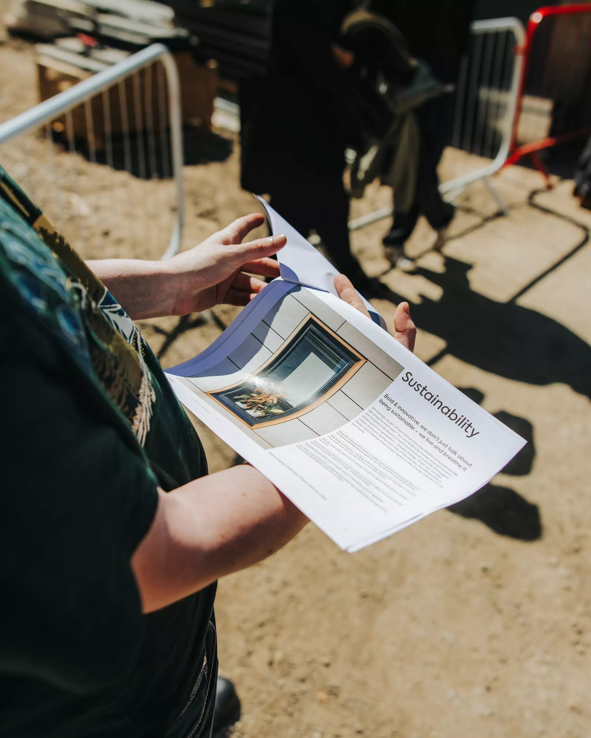 A customer studies a brochure on the climate innovation district