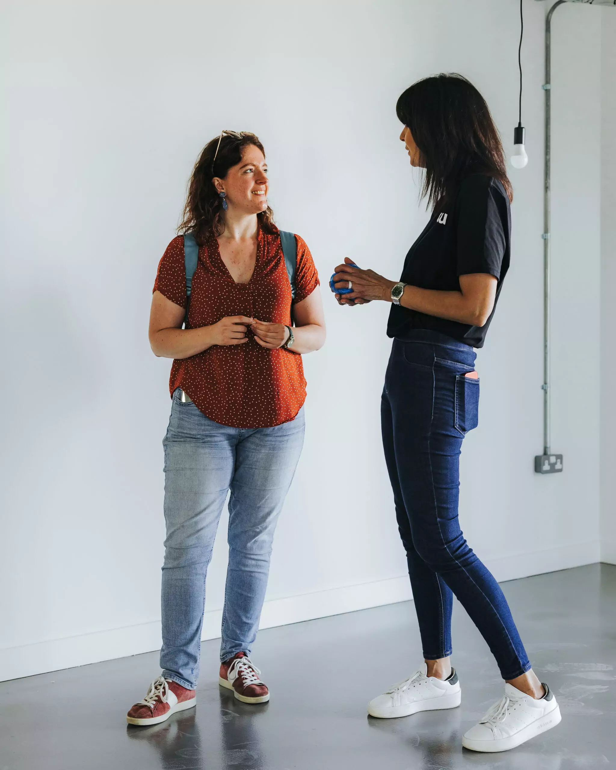 Sales person Sharan explains the home to a customer