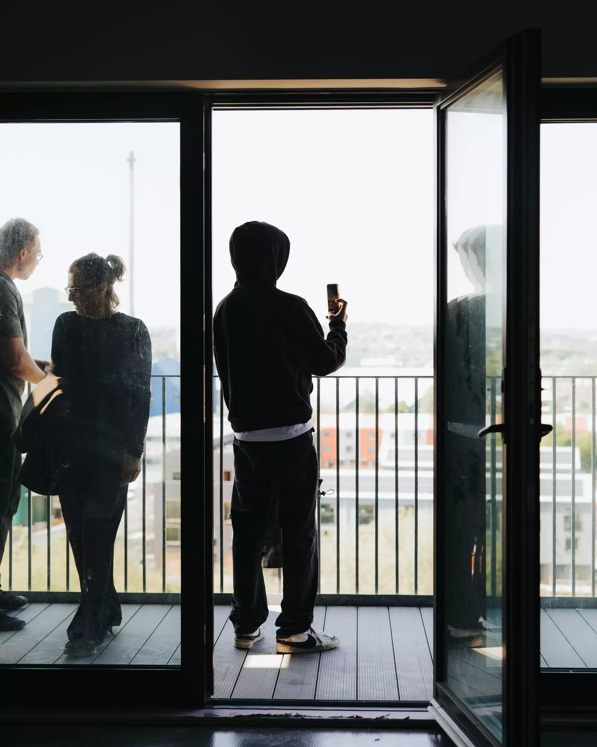 Customer takes a picture of the view from District Lofts